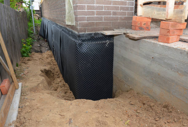 SJ Waterproofing Pros technician performing targeted Foundation Crack Repair assessment in Lawrenceburg, IN